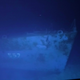The hull with number 557, identifying the ship as the USS Johnston.